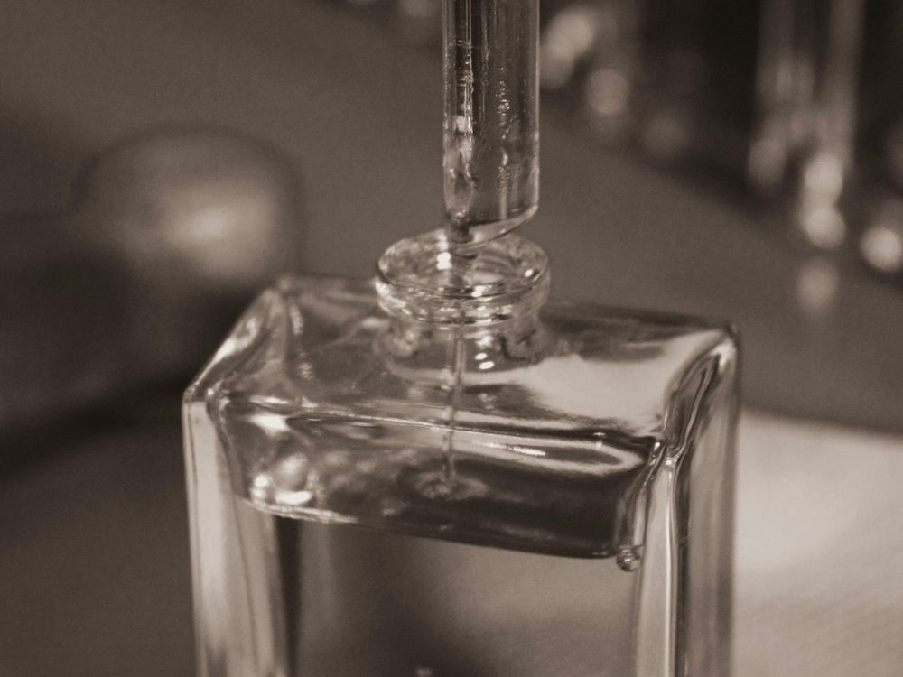 Perfume bottles and blotters arranged on a table