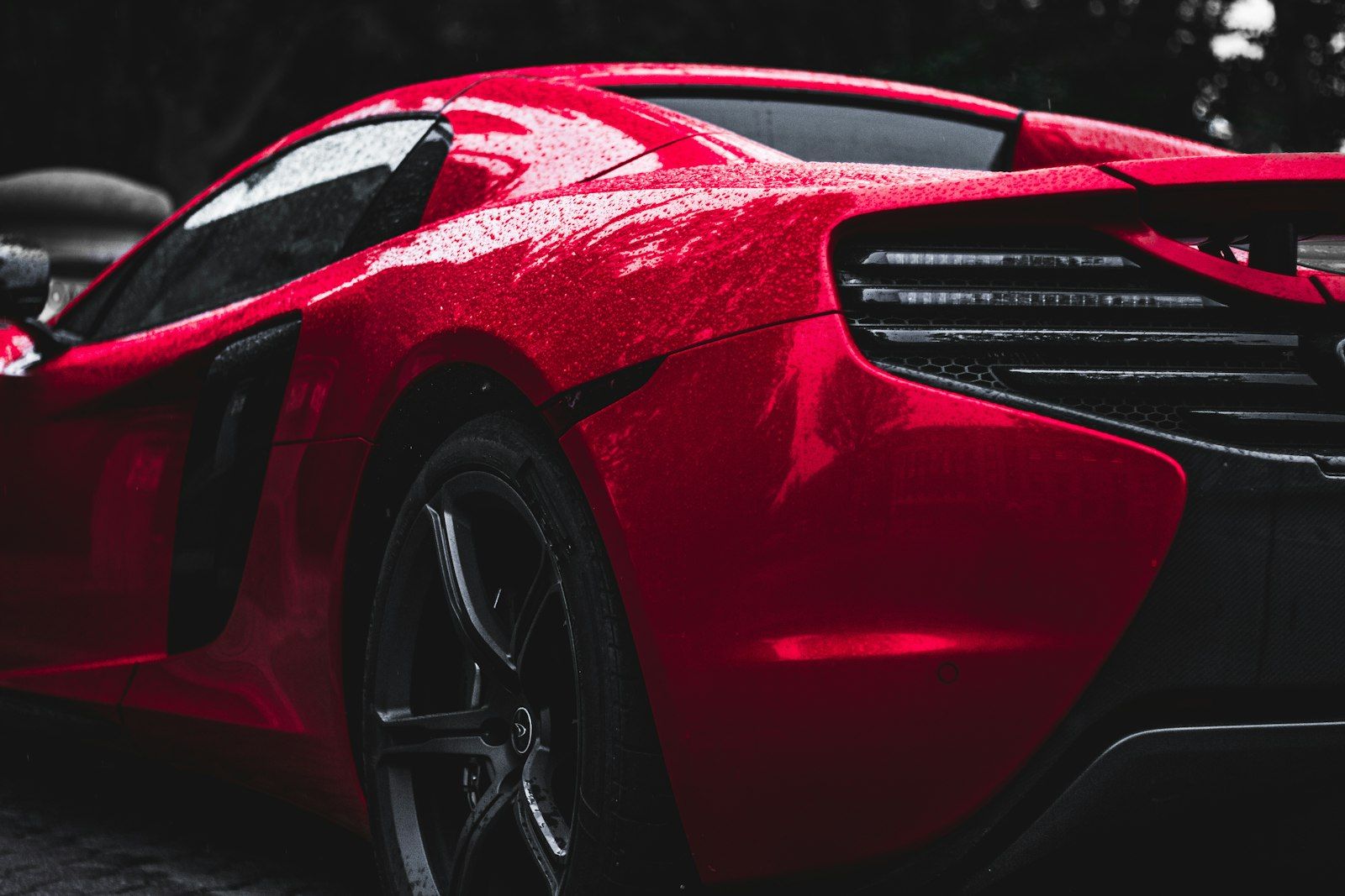 Glossy red sports car in a studio