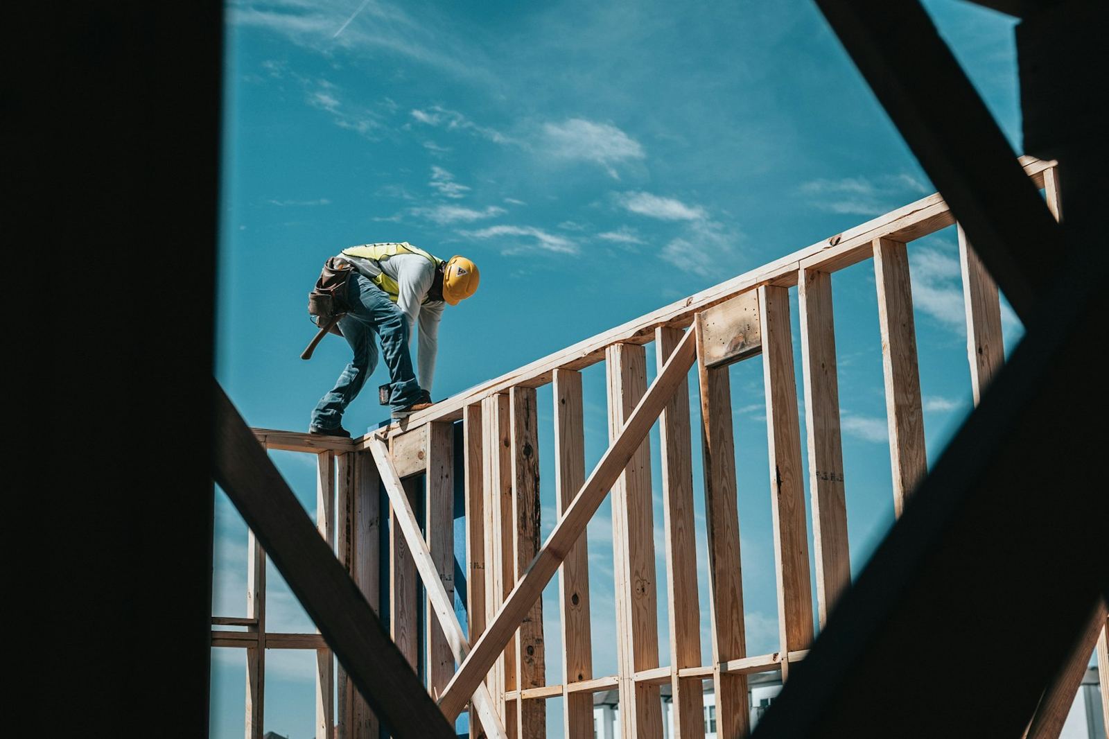 Carpenter on top of new wall framing