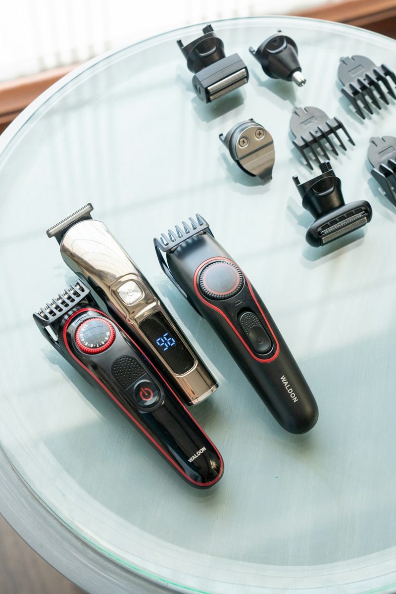 A table topped with different types of hair clippers