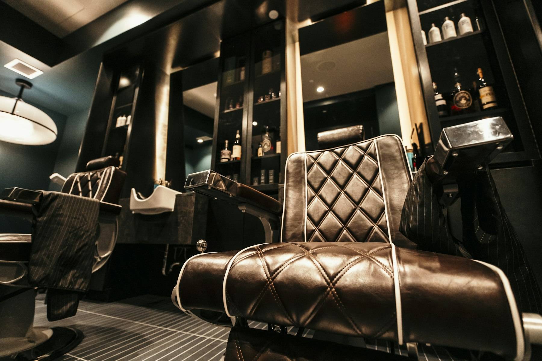 A barber shop with a chair and a mirror