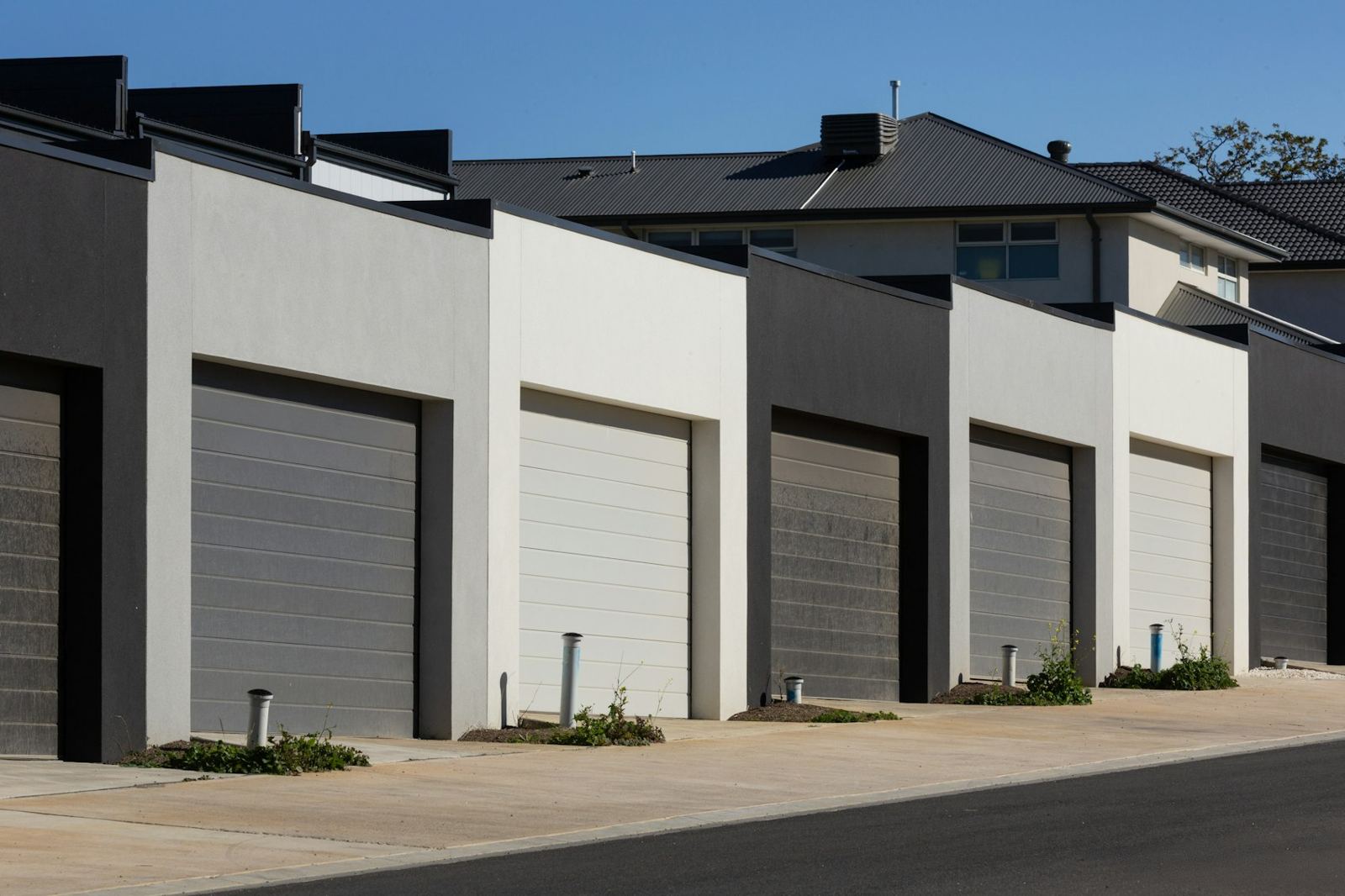 Row of townhomes with new concrete driveways