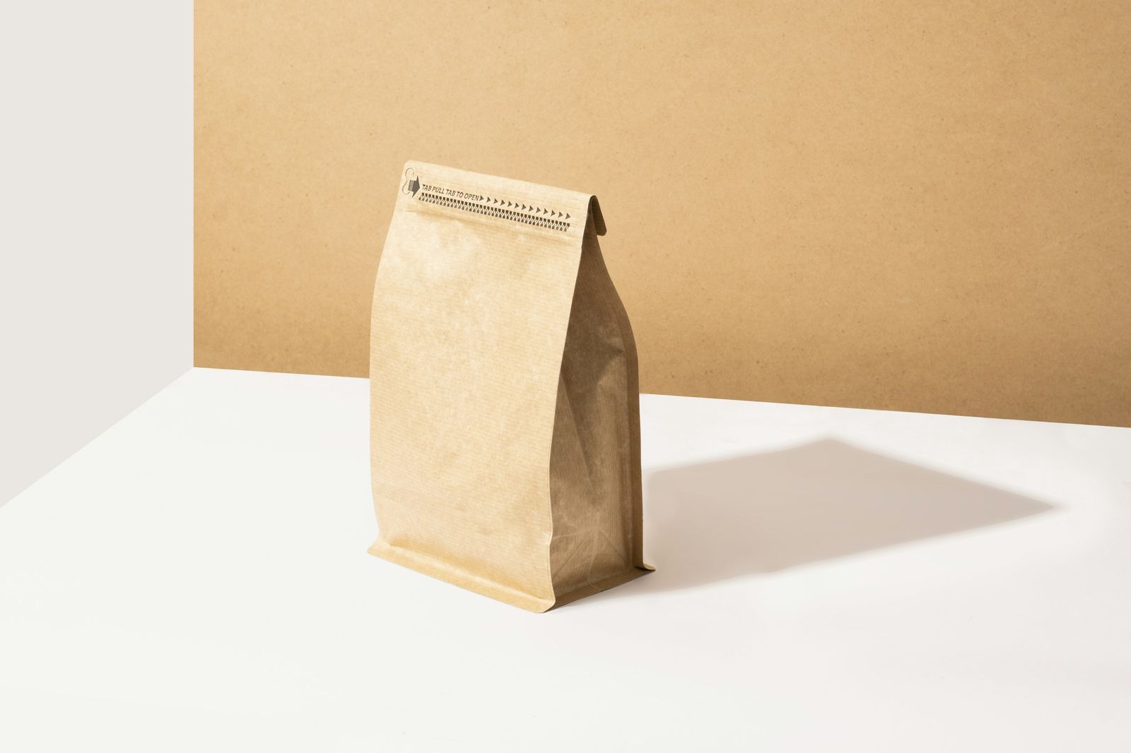 Kraft coffee bag on a sunlit table