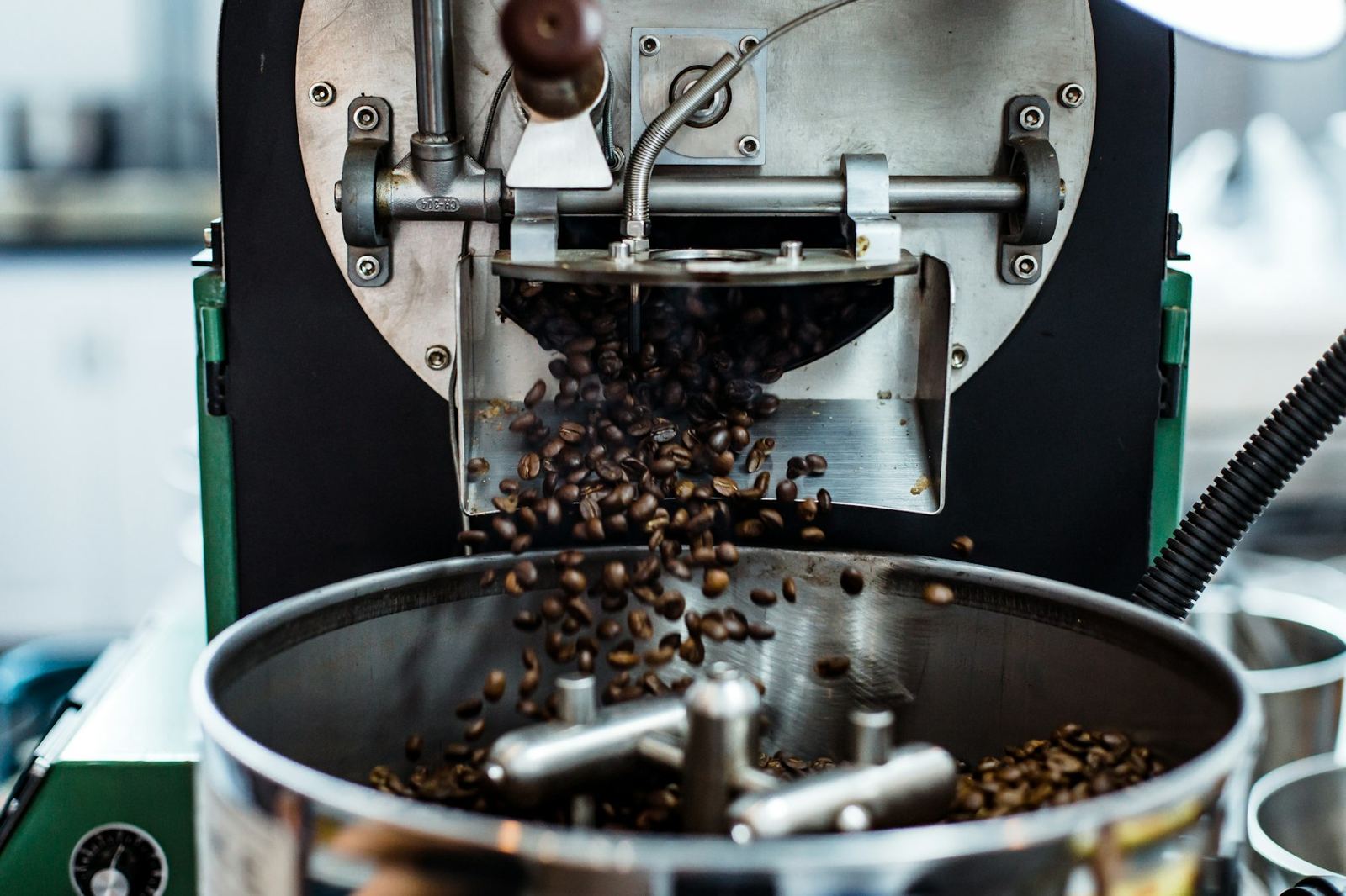 Freshly roasted beans tumbling out of a roaster