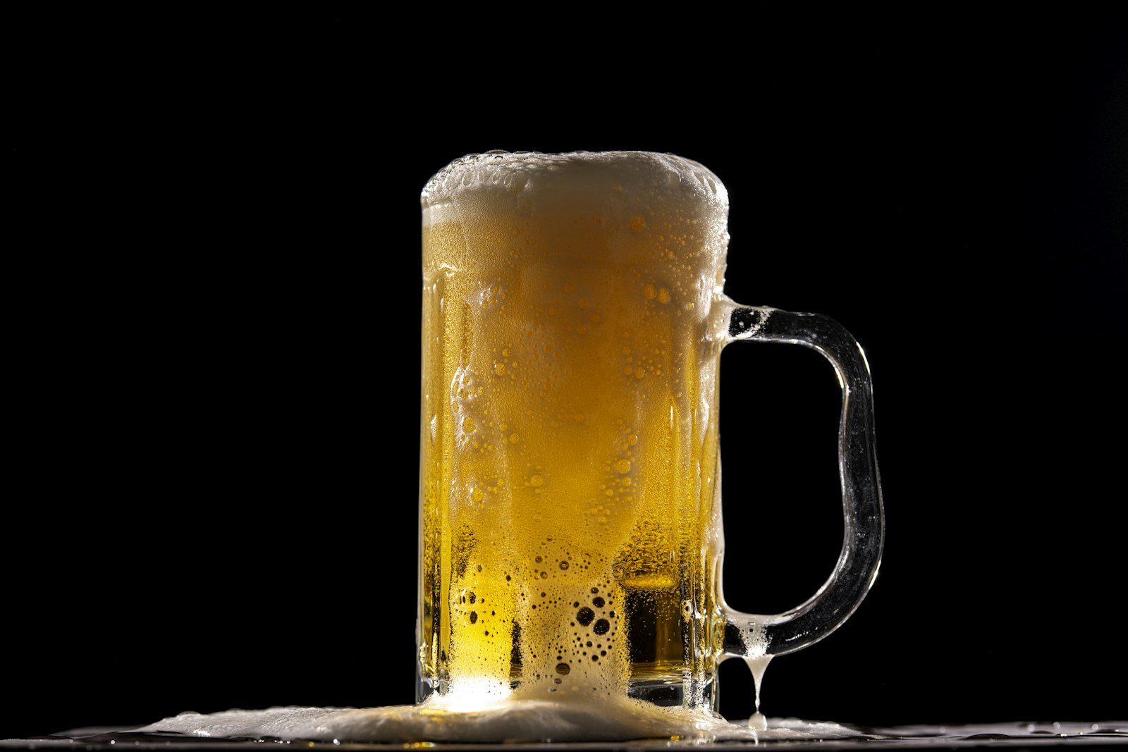 A pint of golden ale with a thick head