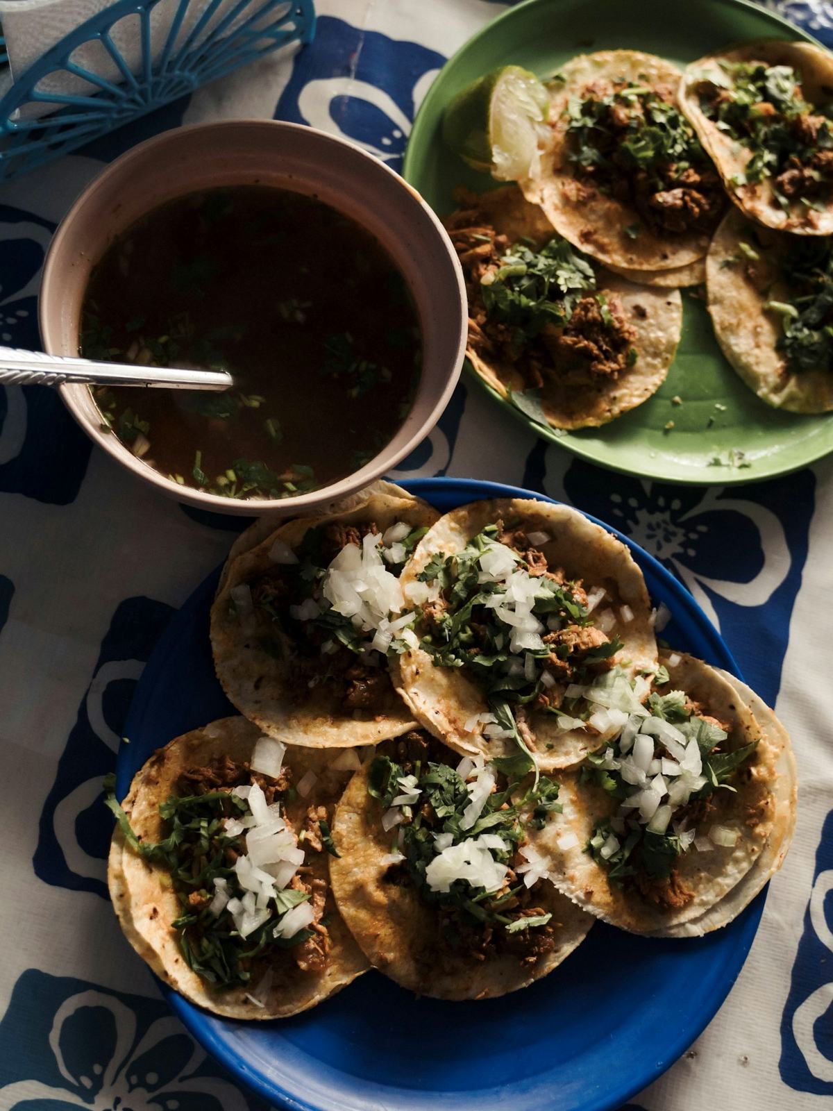 Tacos and a bowl of consomé from above