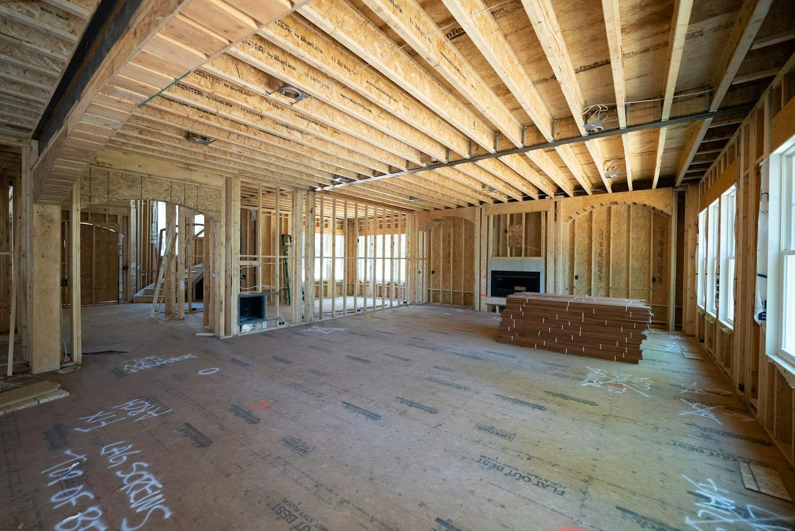 Framed addition interior with open ceiling joists