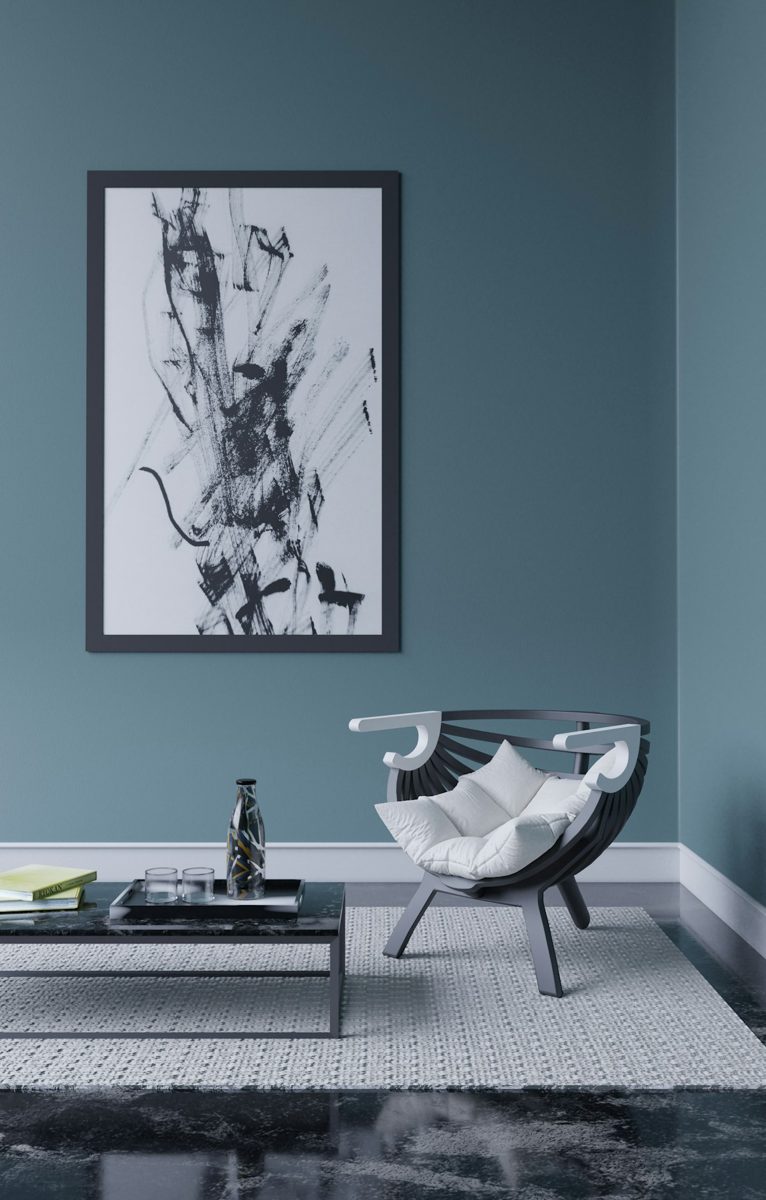 A living room with a painting on the wall