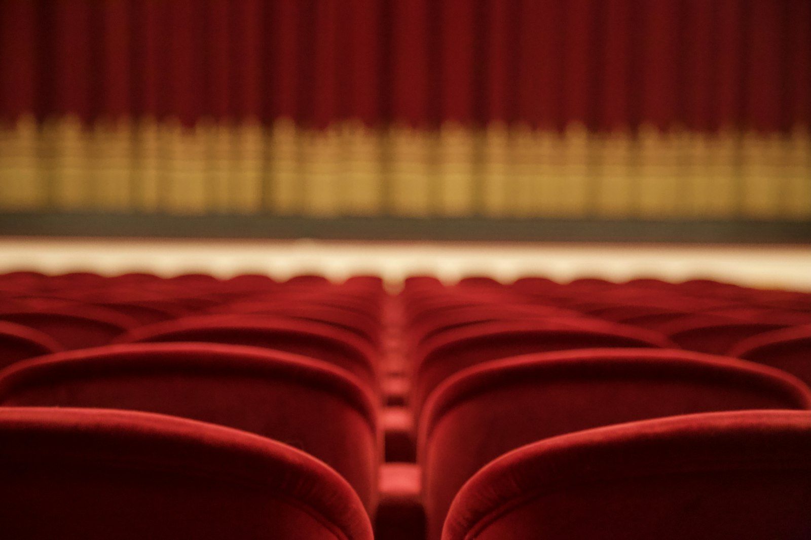 Rows of red theater seats