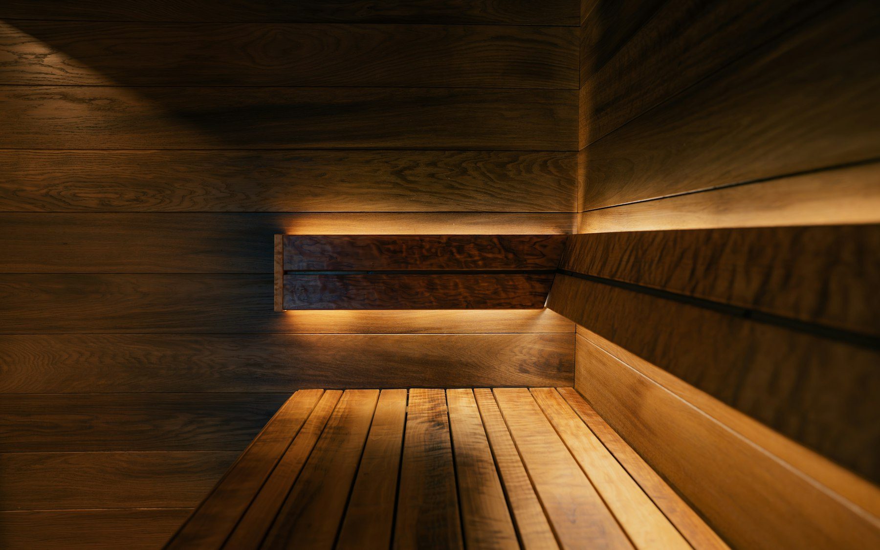 Cozy wooden sauna with warm ambient lighting