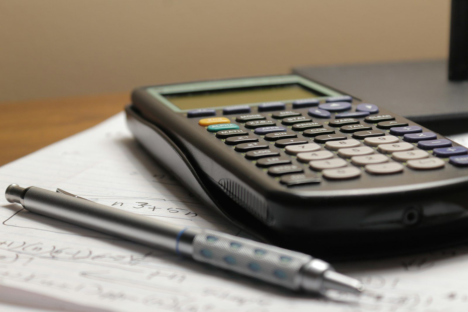 Tidy desk with calculator and pen