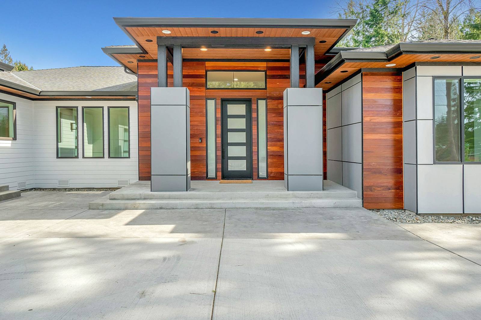Modern single-story home with cedar entry