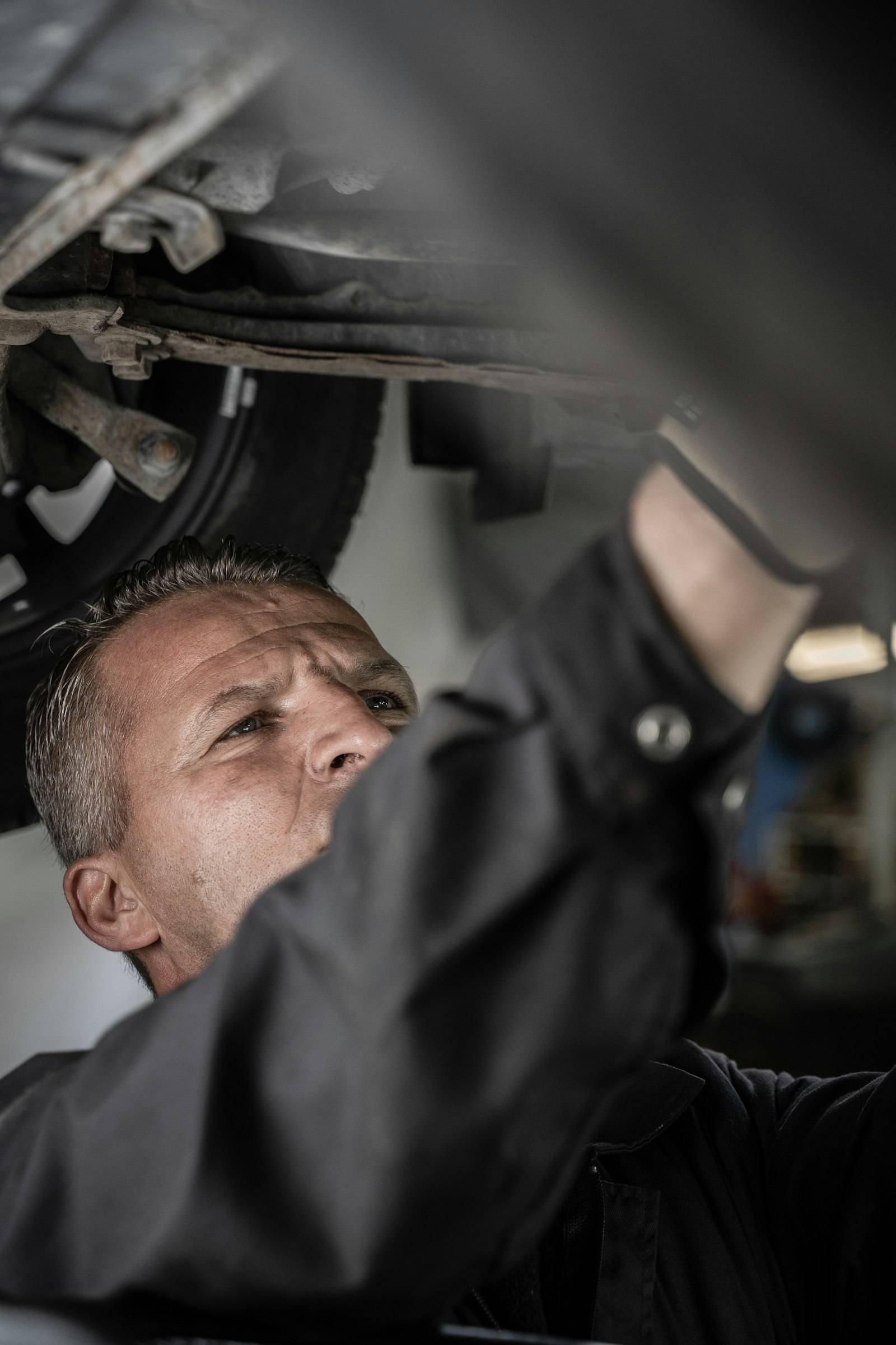 Mechanic working underneath a truck