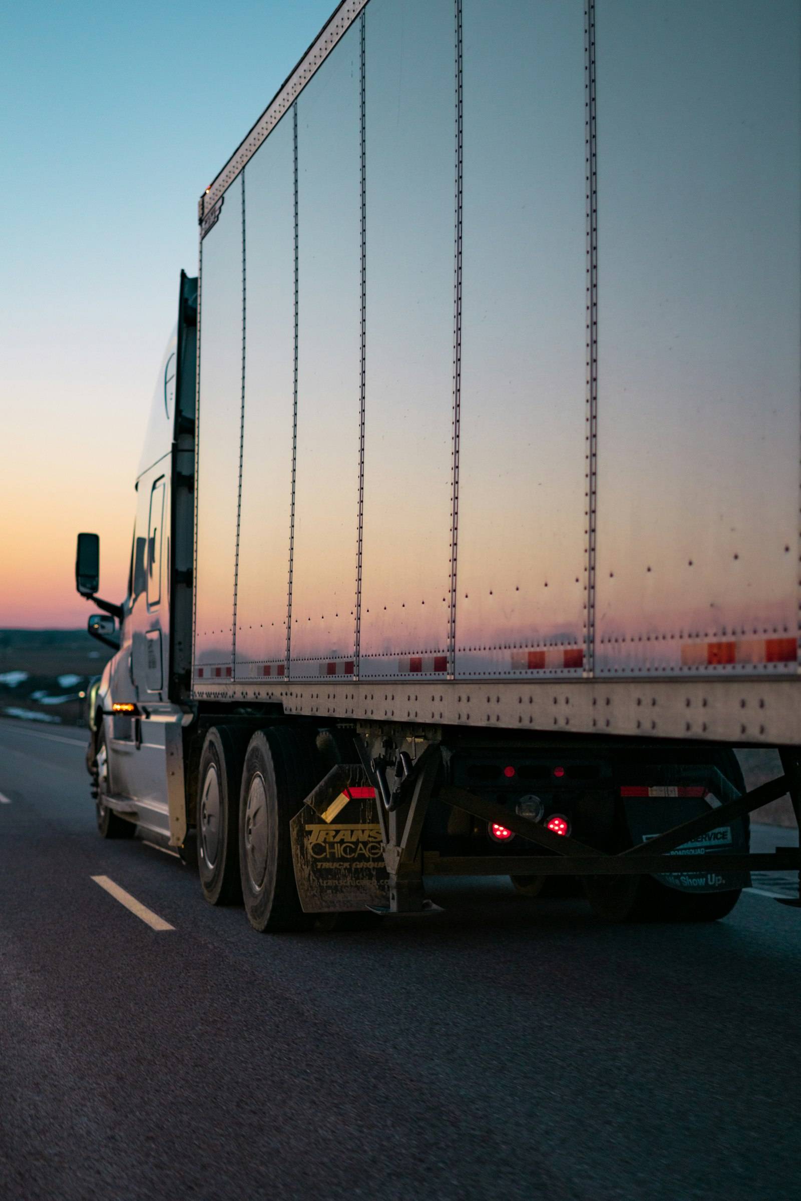 Semi trailer on the highway at dusk