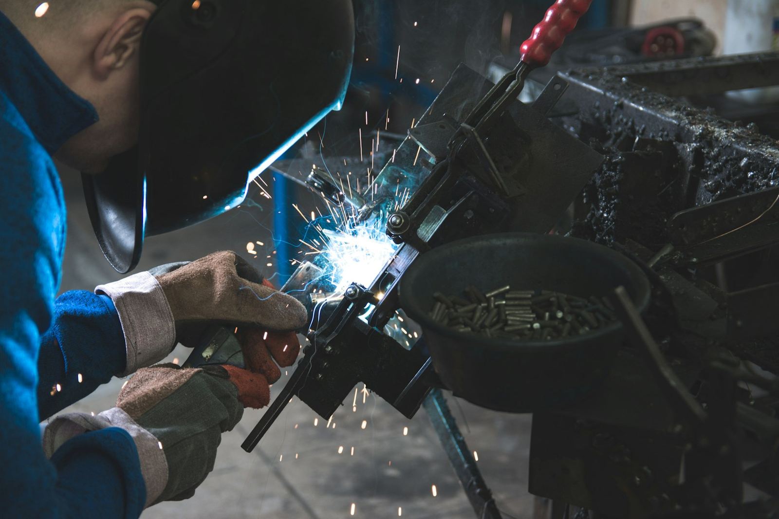 Welder joining a steel part