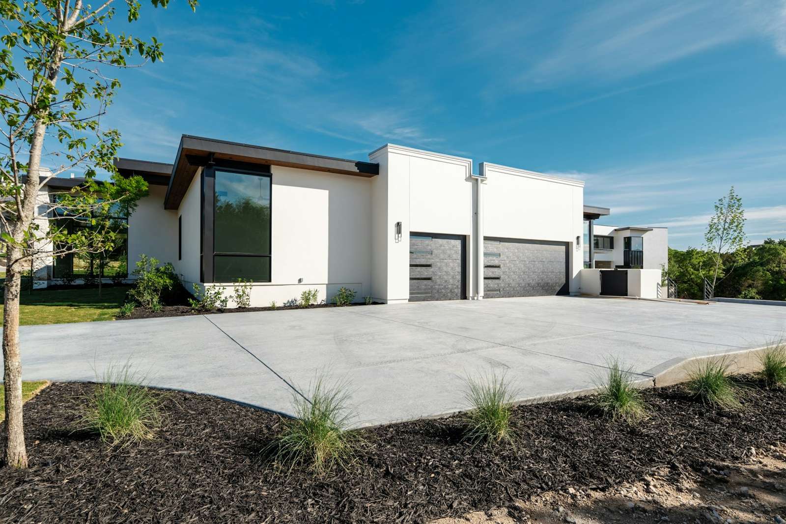 White modern home with dark doors