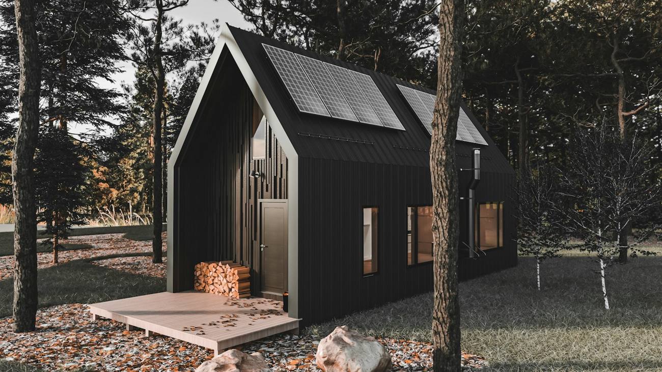 Dark gabled modular unit among trees