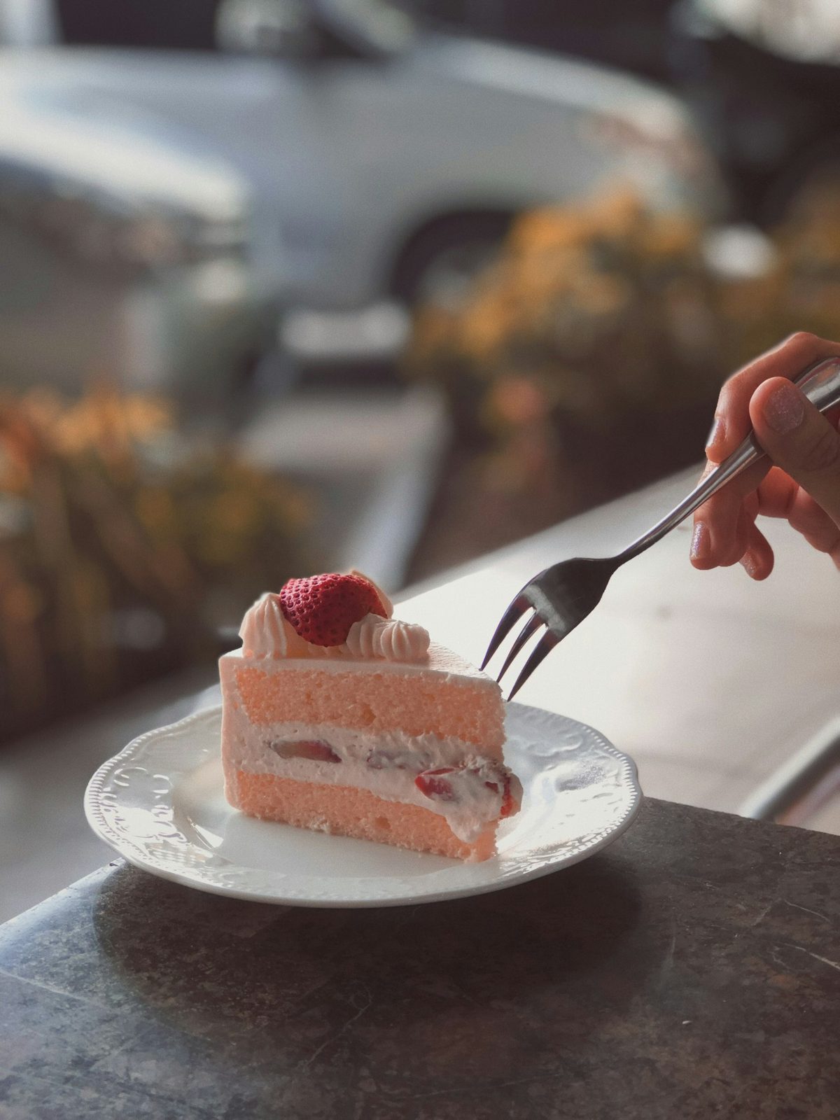 A slice of strawberry layer cake