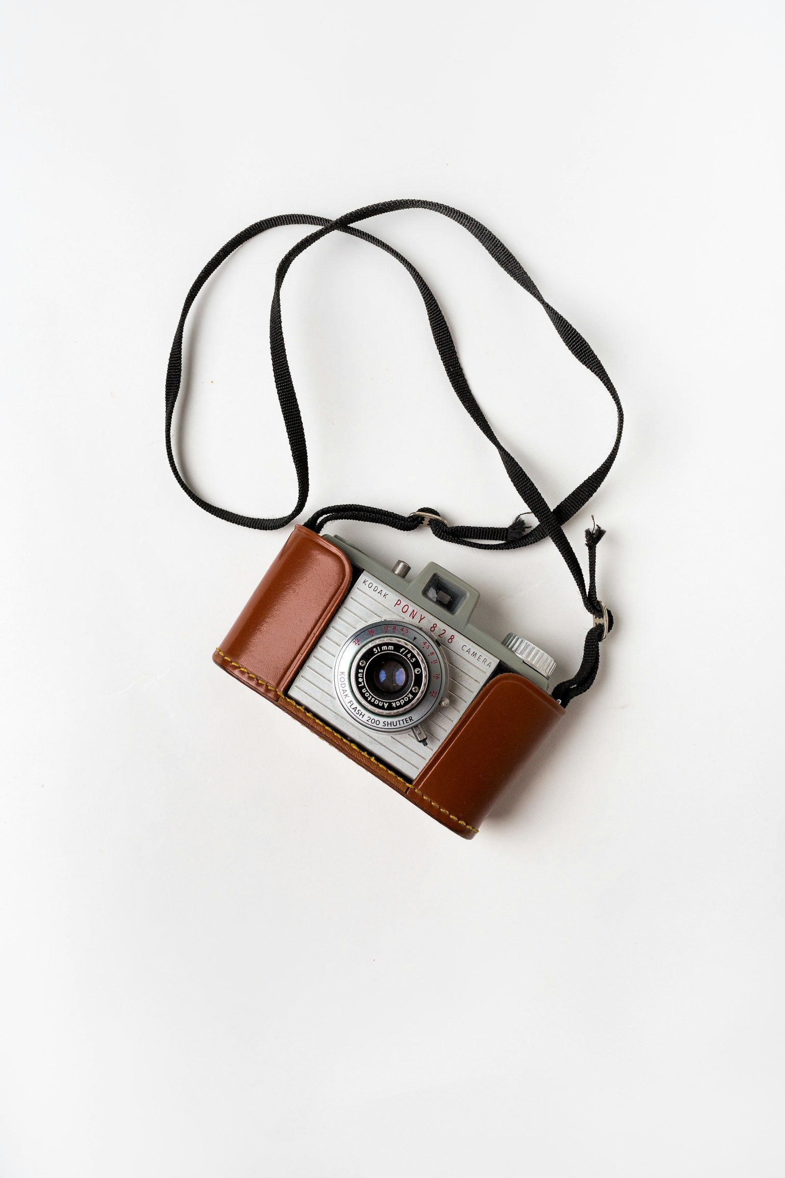 Camera with brown leather case