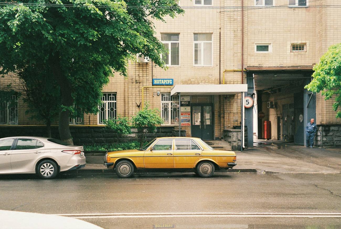 Street scene with a yellow car shot on film