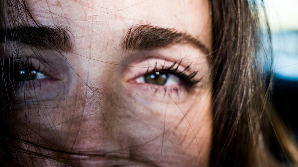 Woman with black hair and blue eyes