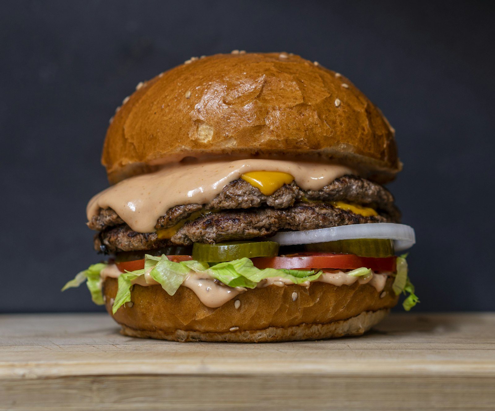 A classic cheeseburger with lettuce and sauce