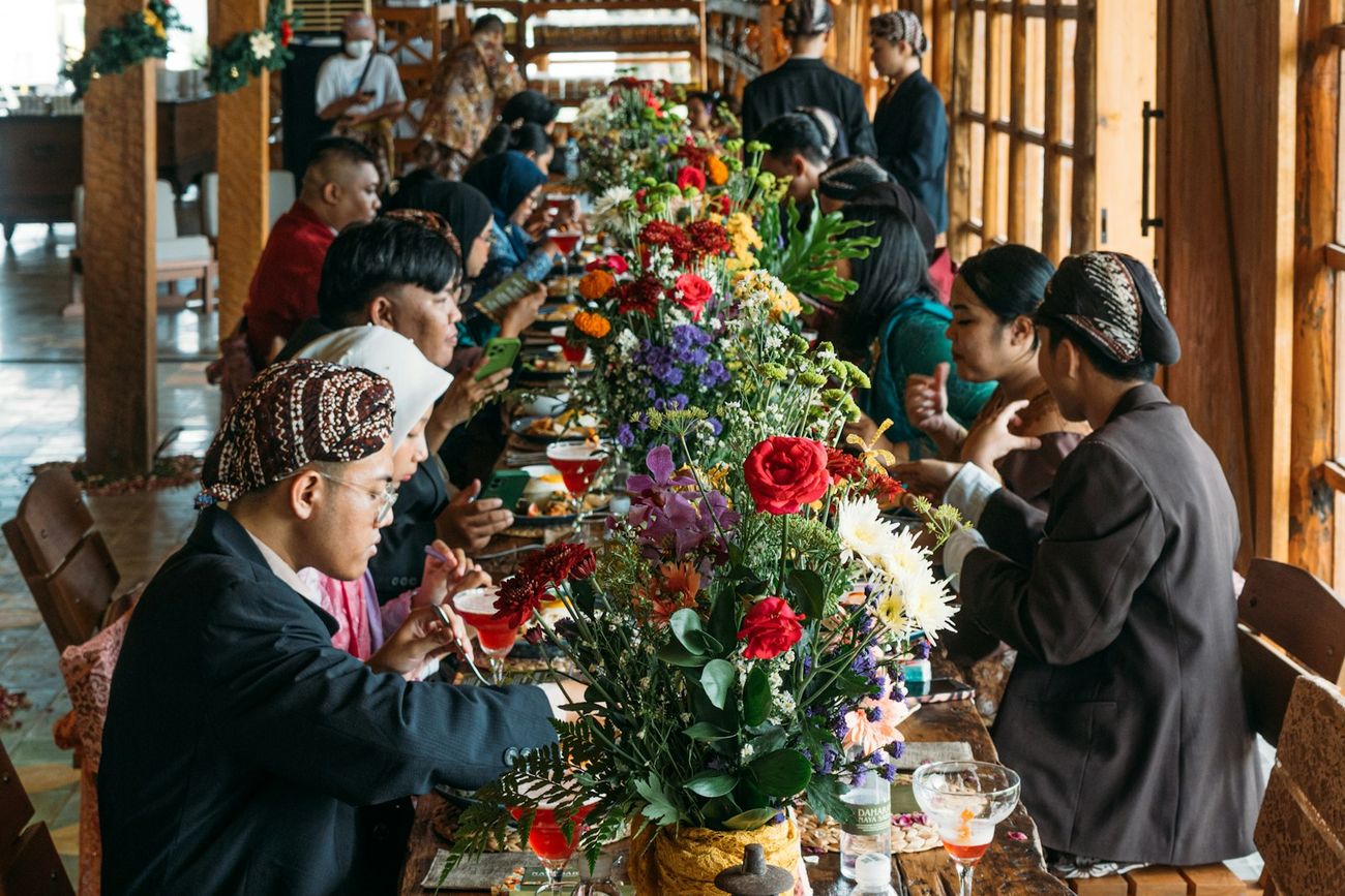 Crowded long tables in a market hall