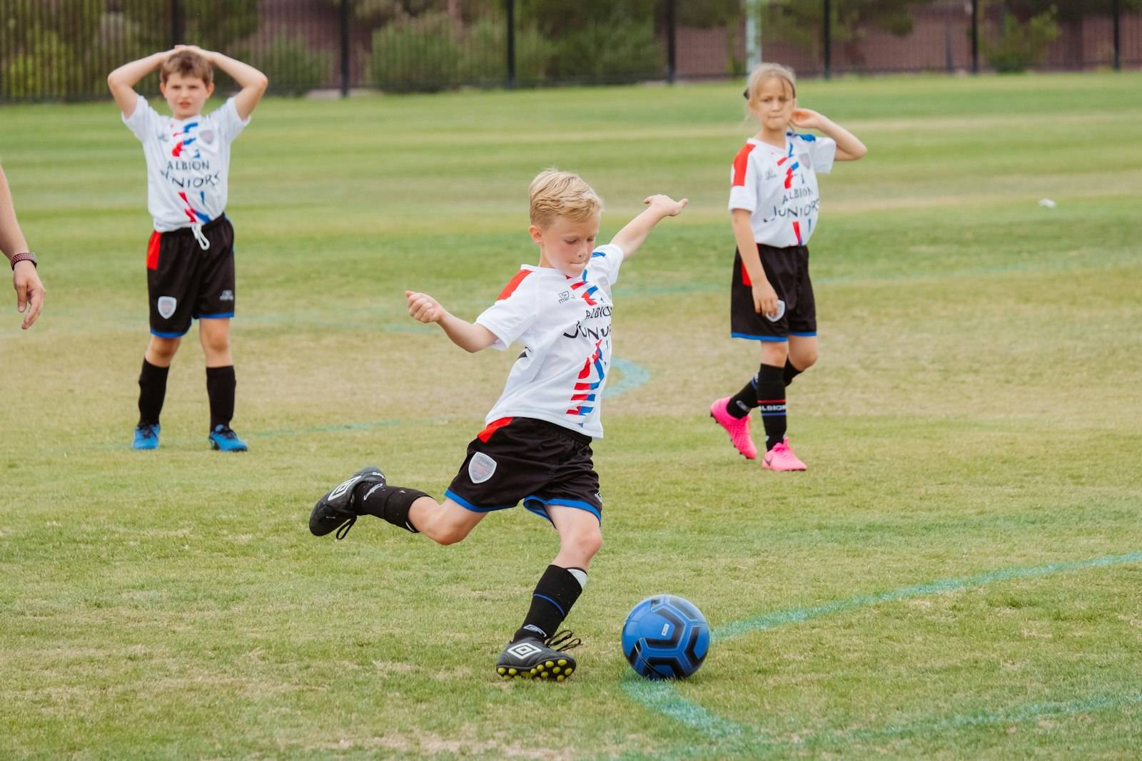 Young player kicking the ball