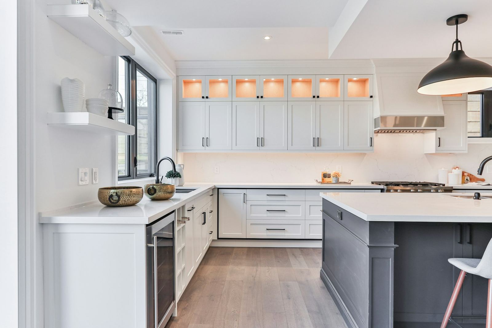 Kitchen with dark island and open shelving