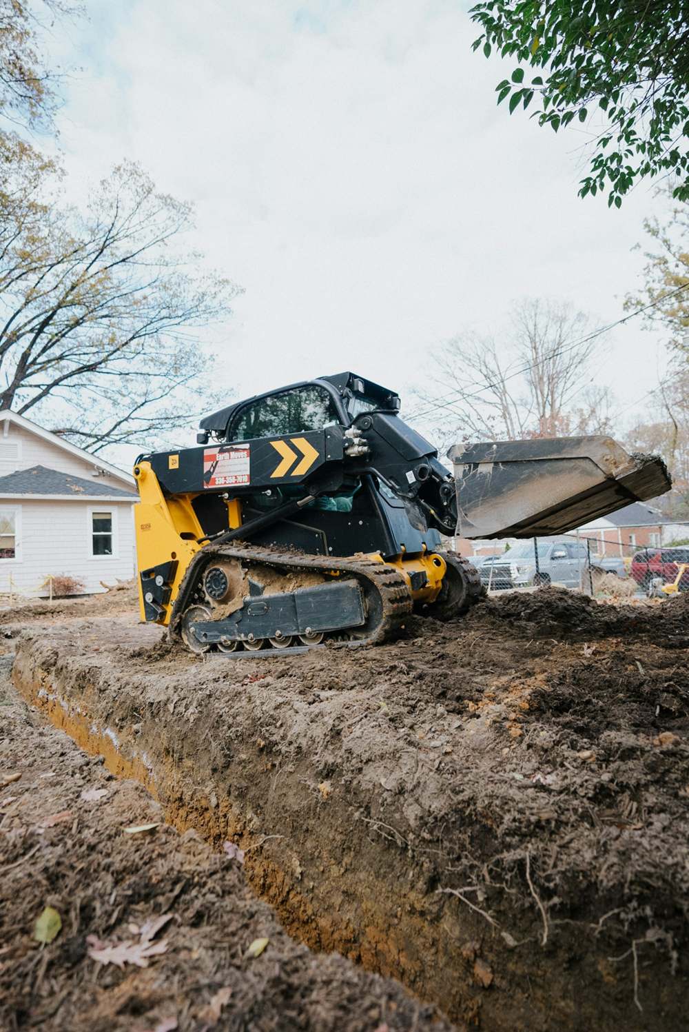 Compact track loader on a job site