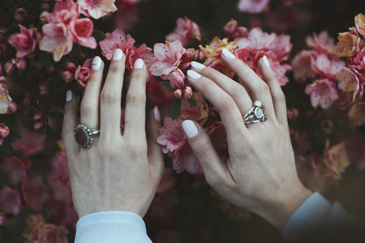 Person holding pink flowers