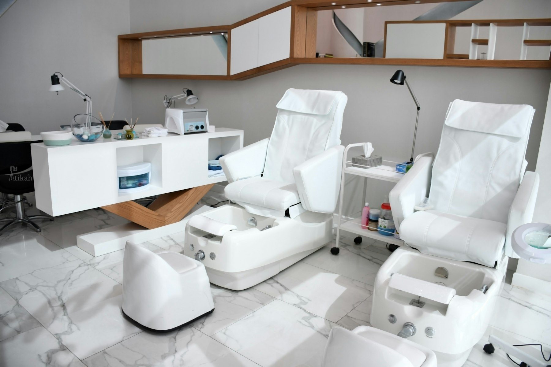 White rolling chairs near brown wooden desk