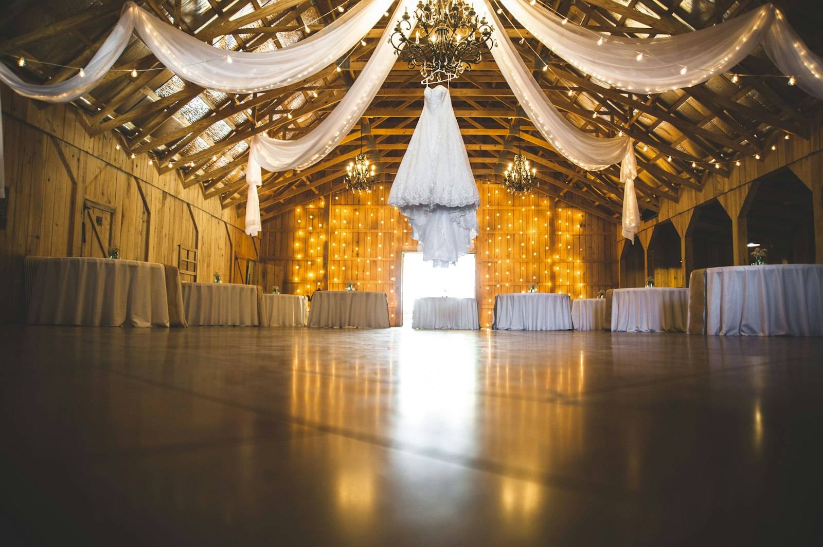 Barn hall with draped fabric and lights