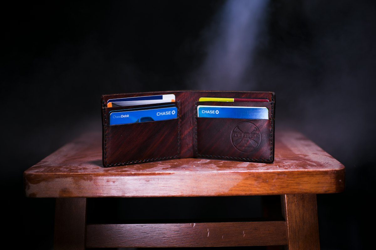 Brown leather bifold wallet on table
