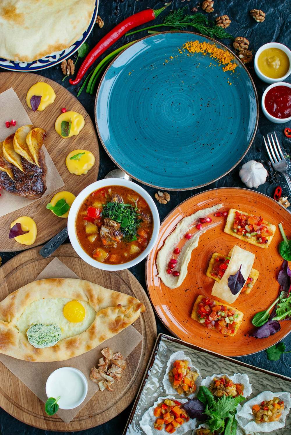 A table spread with many Persian dishes