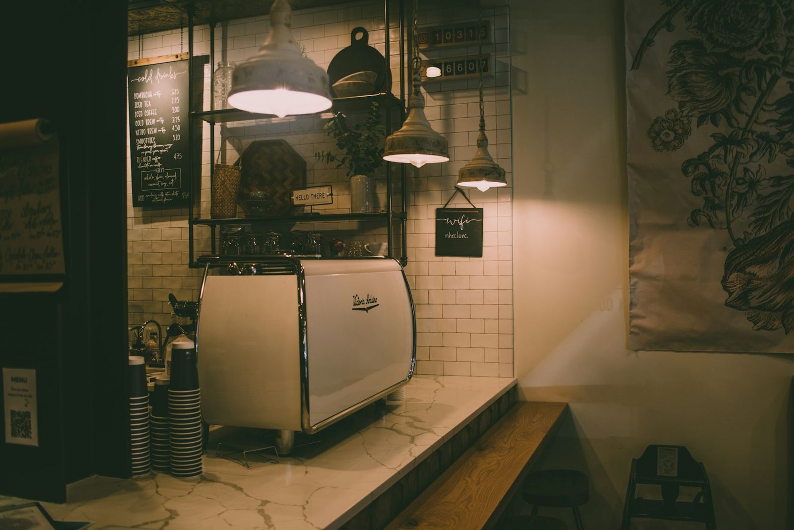 A quiet marble coffee counter in soft light
