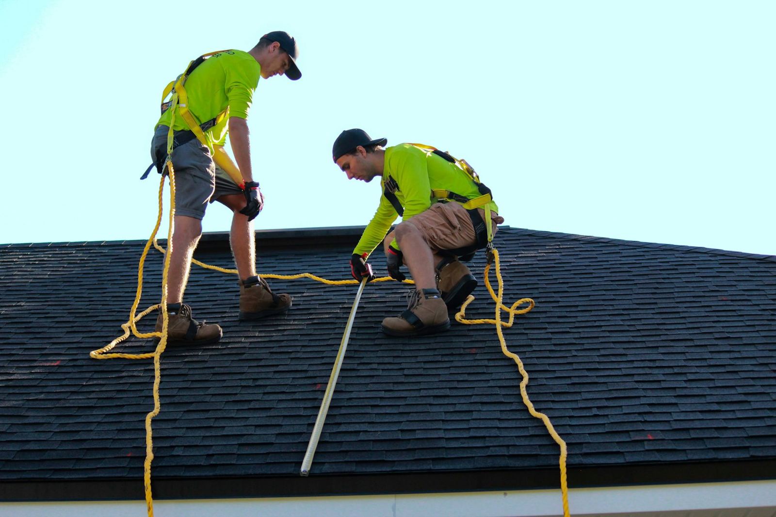 Two installers securing a roof