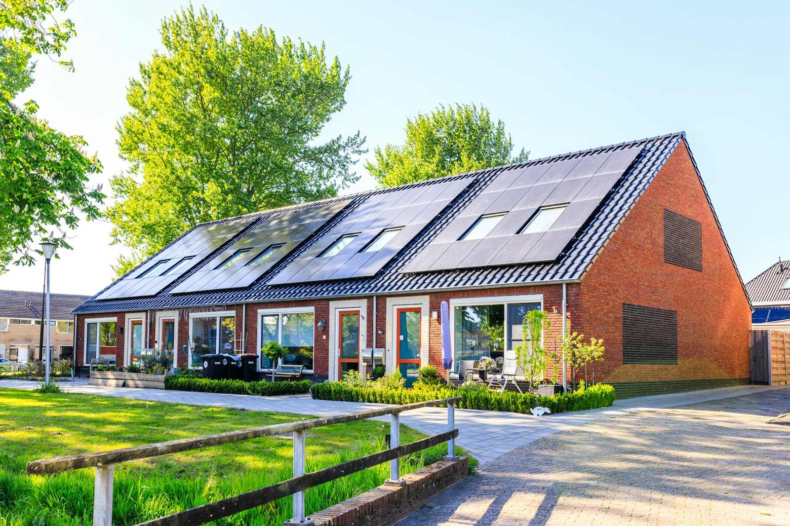 Brick row homes with solar panels on the roof