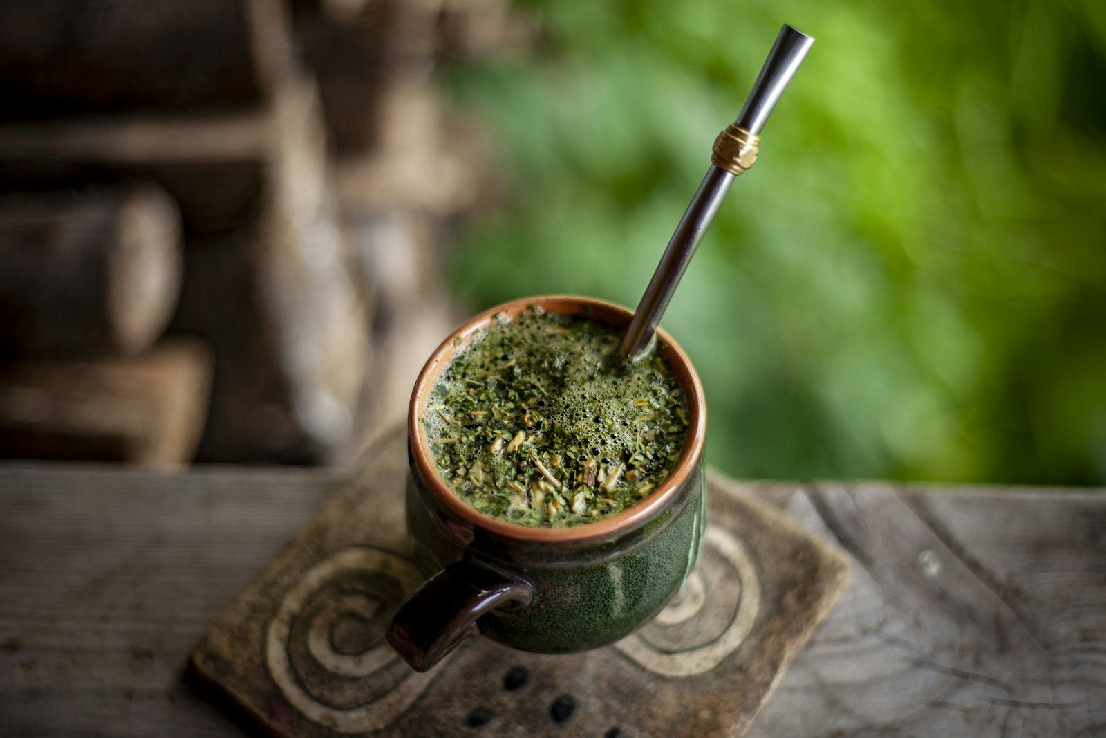 Mate gourd on a wooden table outdoors