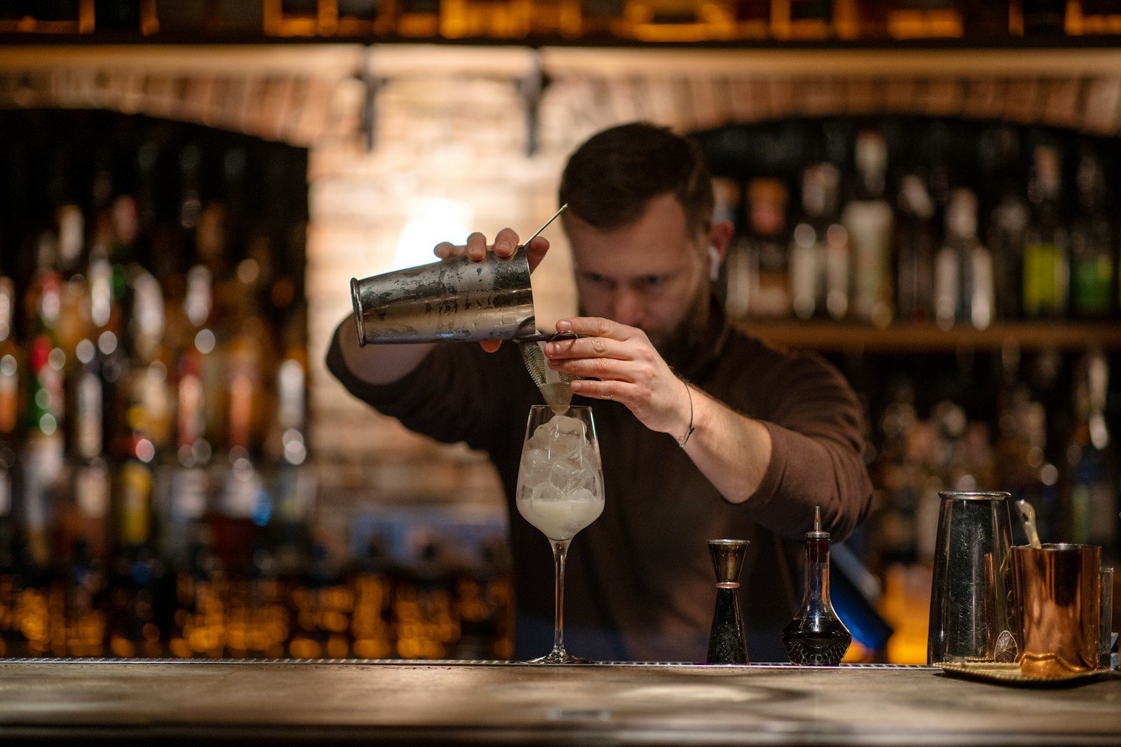 A bartender pouring