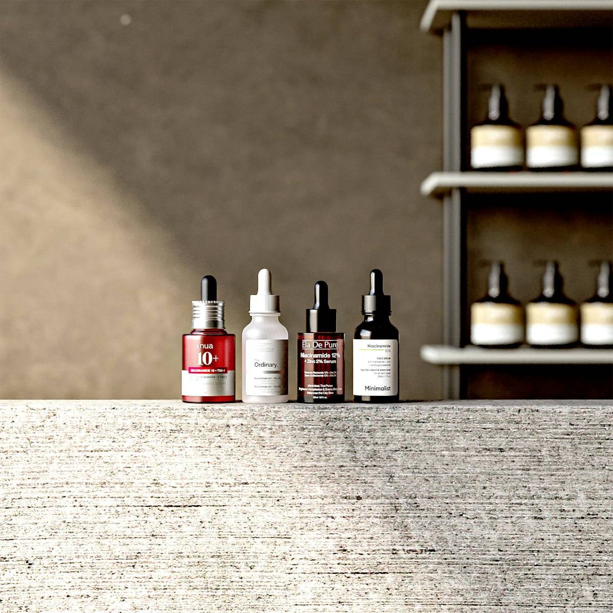 Four dropper bottles of facial serum on a textured stone ledge in sunlight